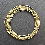 A coil of 3-ply gold lamé.