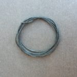 A coil of our black waxed cord.