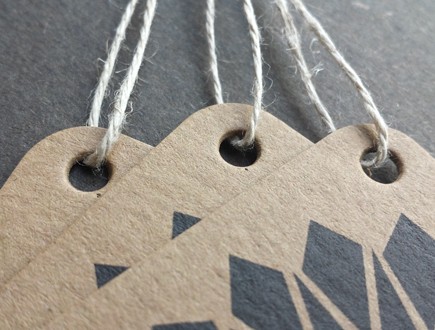 Tags on heavy brown paper stock with geometric graphic element strung with our 3-ply hemp.