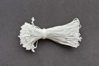 Bundle of loops of standard white elastic.
