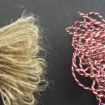 A selection of bundles of loops of some popular options, including (at left) jute twine and (at right) red-white variegated Pearlray.