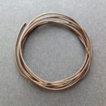 A coil of our brown non-fray elastic.