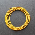 A coil of our gold non-fray elastic.