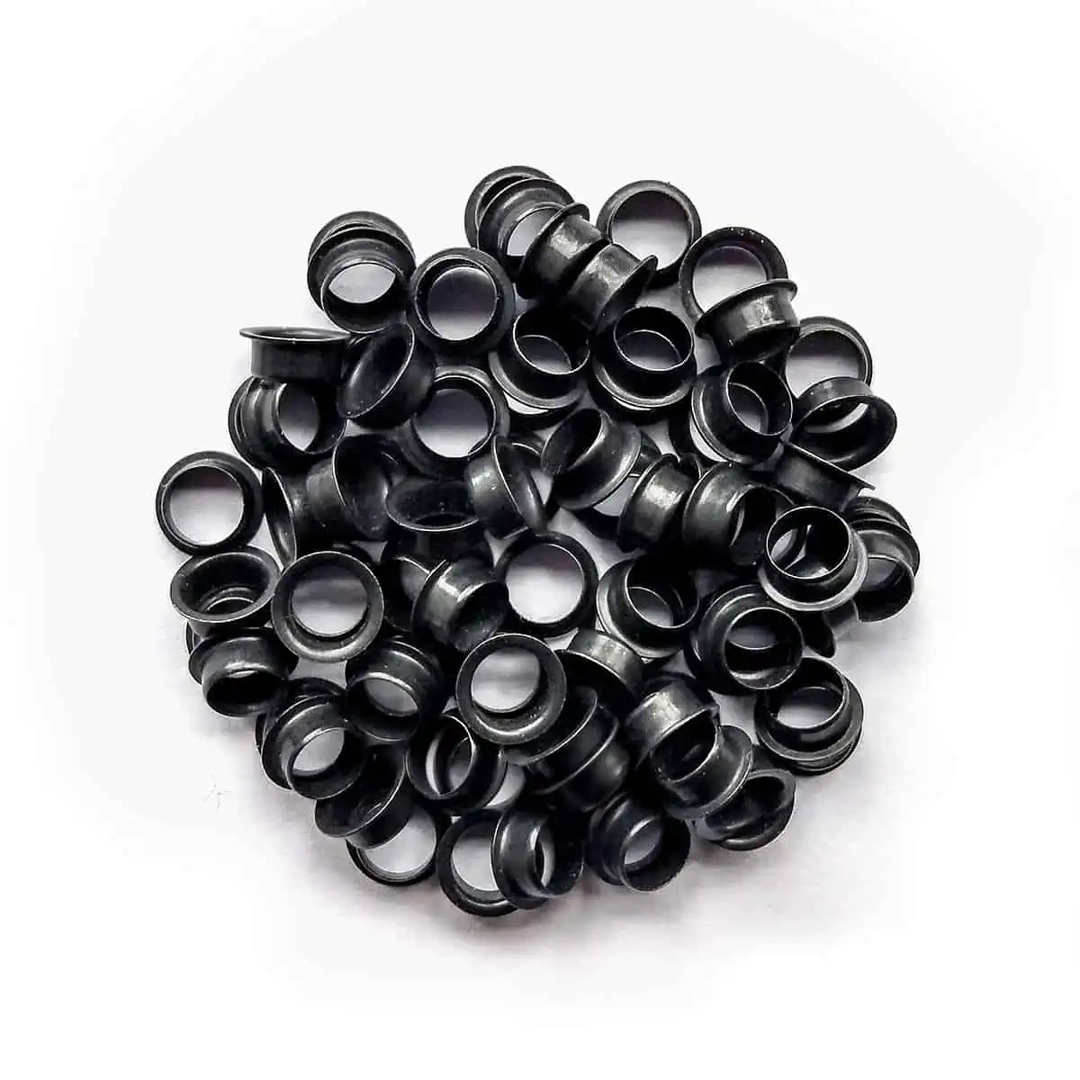 A pile of M&F Stringing's black eyelets.