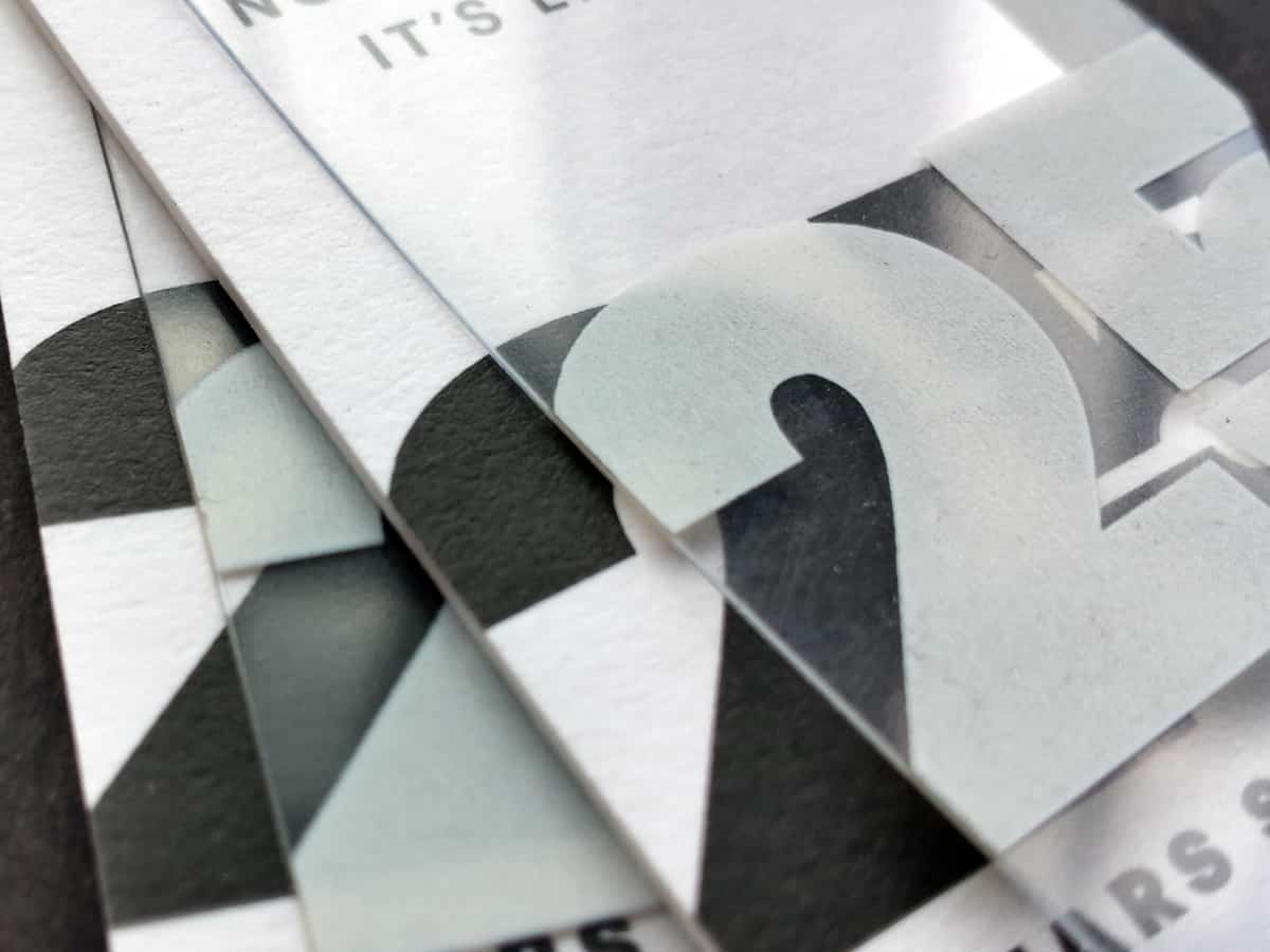 Photograph of two assemblies composed of two tags hand-strung together.