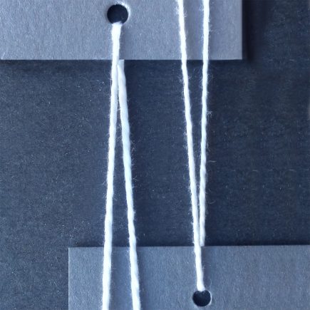 Comparison photograph of 3/2 (at left) and 5/2 (at right) mercerized cotton in white.