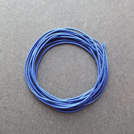 A coil of our blue non-fray elastic.