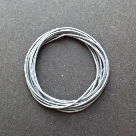 A coil of our gray non-fray elastic.