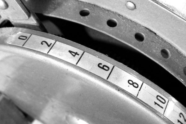 packing-featured A monochrome photograph of a principal component of our packing process: our vintage tape machine, still going strong after decades of use.