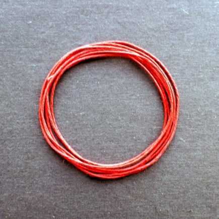 A coil of our red waxed cord.