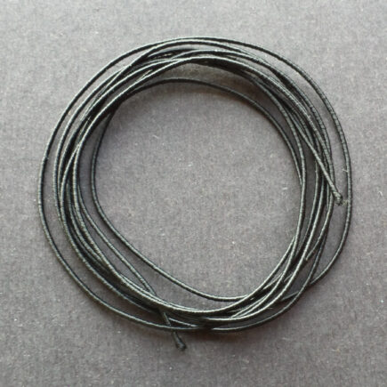 A coil of our standard elastic in black.