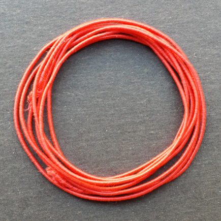 A coil of our standard elastic in red.