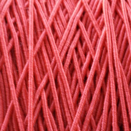 A spool of our standard elastic in red.